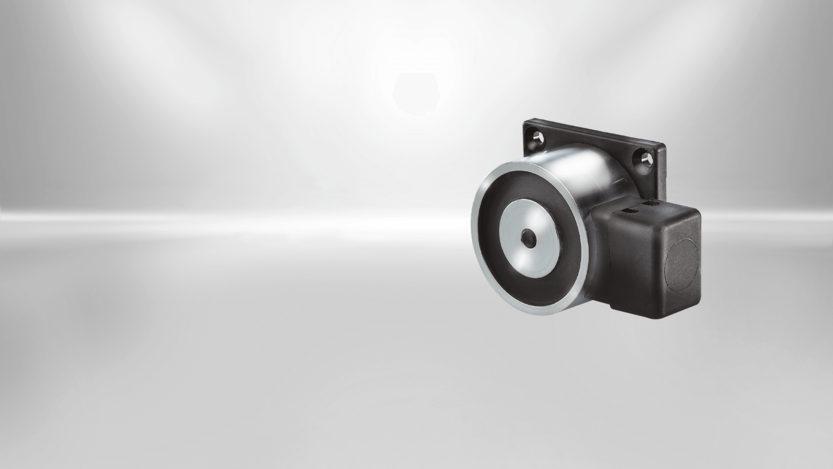 Door holding magnet SAFE (Base) from Kendrion Door holding magnets from Kendrion are available in different designs. This type of STANDARD Line is staffed with a mounting plate and terminal clamp.