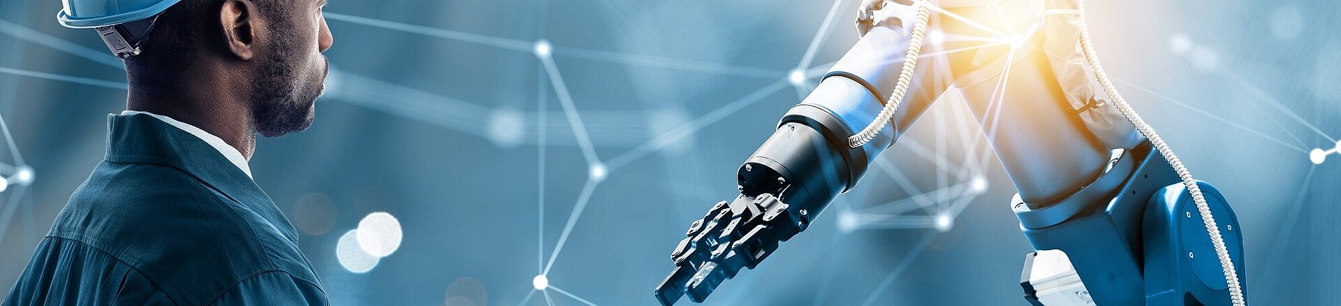 Kendrion-Roboterarm mit Kolloborator und Glow auf der rechten Seite. Blauer Hintergrund mit weißen Linien.